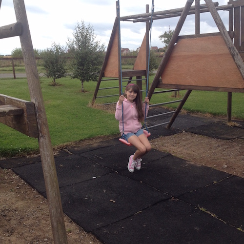 A child on a swing at Silverdyke Park